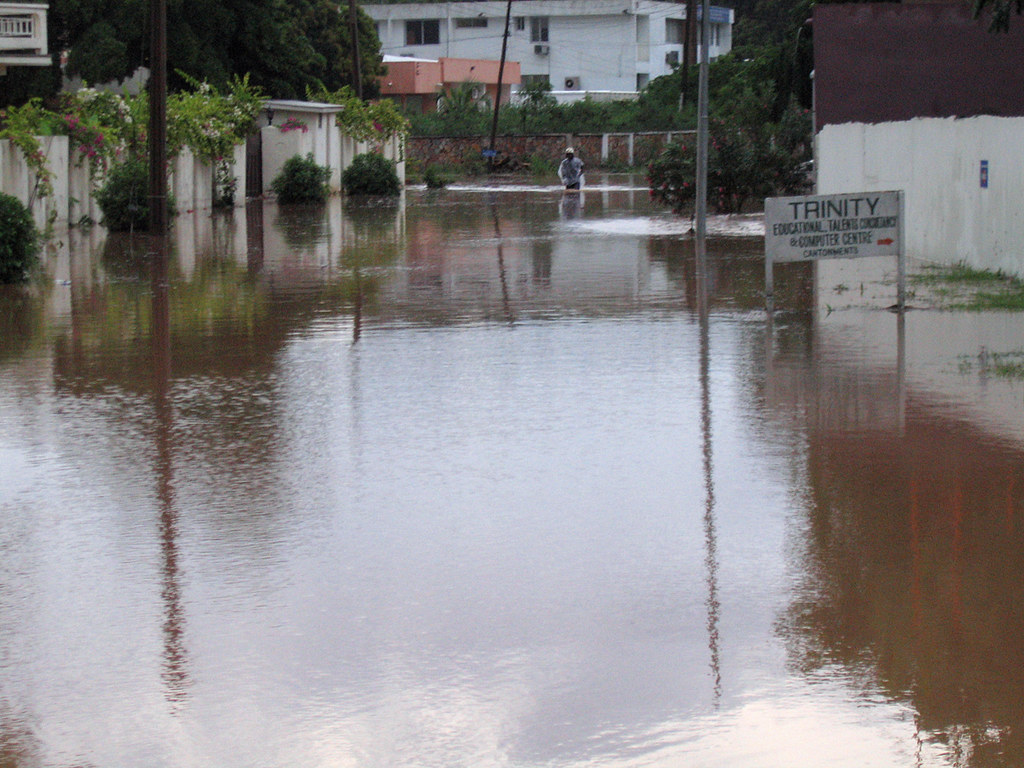 Flooded African street representing the urban flooding behind Kenya's 2026 NGO shelter response