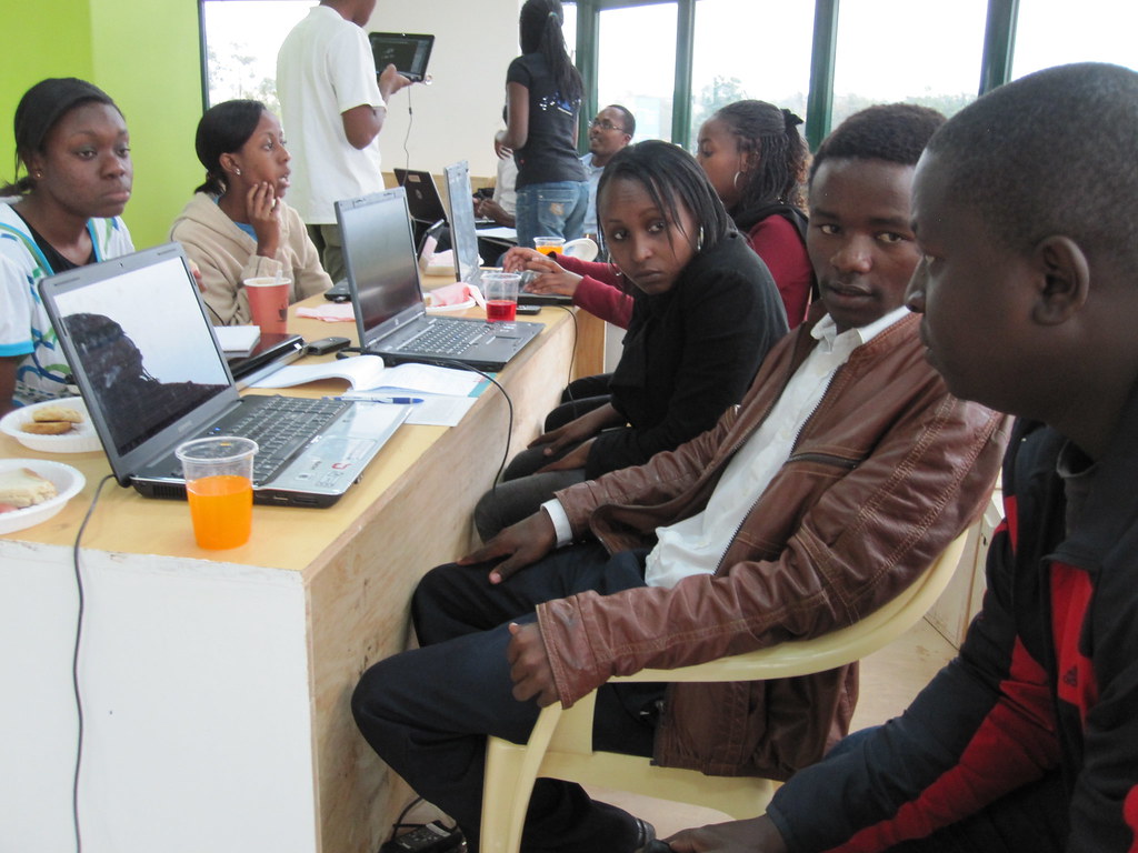 NGO team members collaborating on a grant proposal during a Nairobi workshop