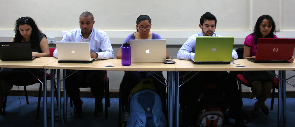 Kenyan youth working at desks during a business and entrepreneurship training session