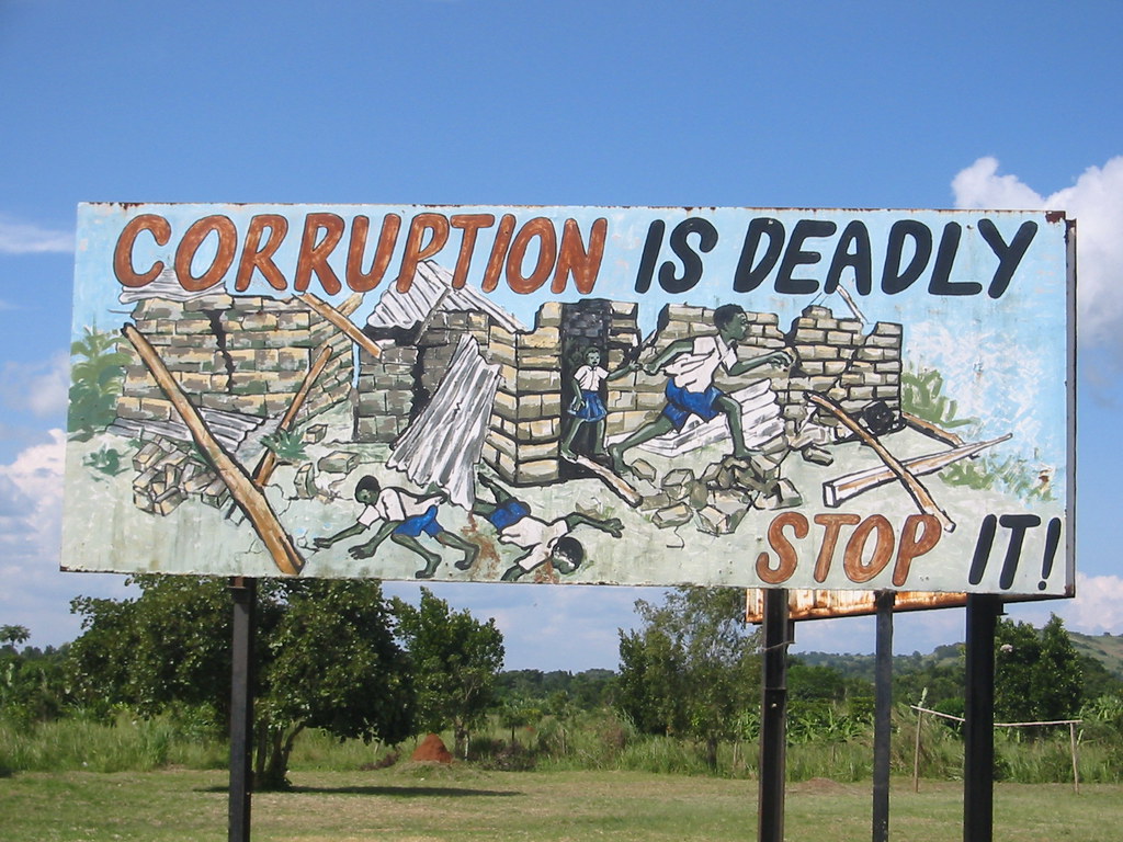 Anti-corruption sign in East Africa, relevant to NGO whistleblowing policy in Kenya