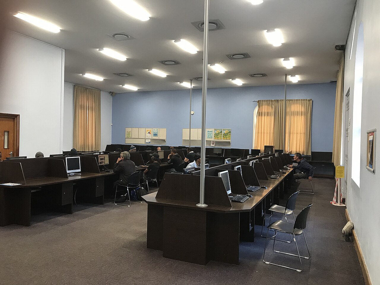 People working at computers in a lab, illustrating the Kenya AI Bill 2026 and NGO digital tools
