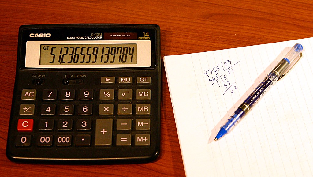 Calculator and notepad on a desk, used for PBO audited accounts in Kenya