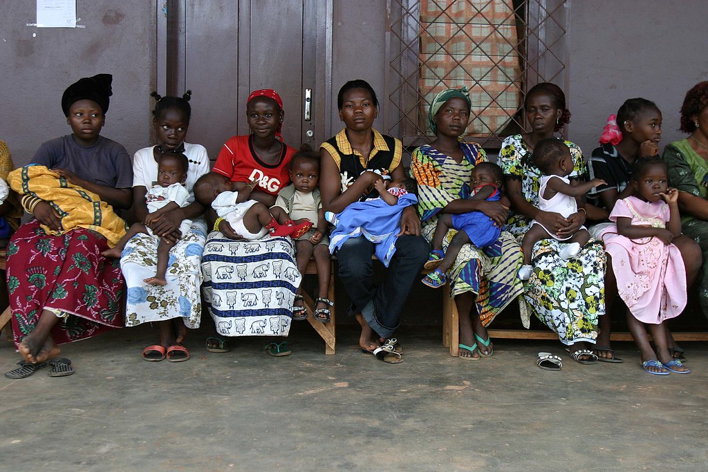 People lining up outside for a polio vaccination campaign, illustrating World Polio Day 2026 work