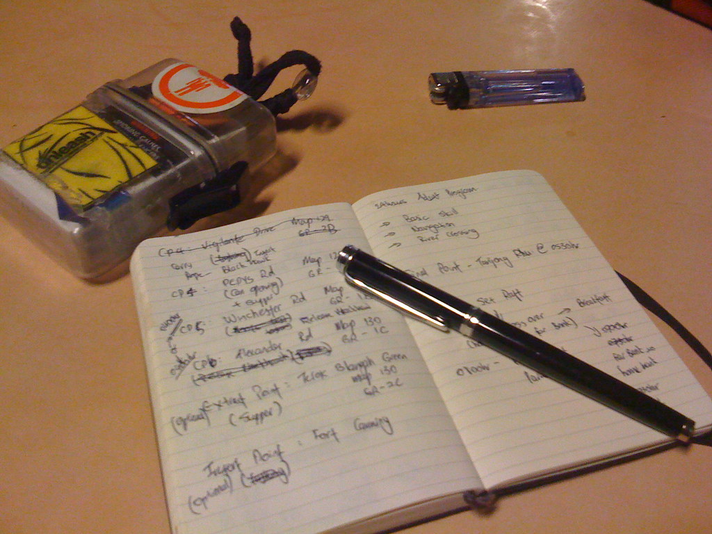 Notebook and pen on a meeting table, ready to draft a safeguarding policy for a Kenyan NGO